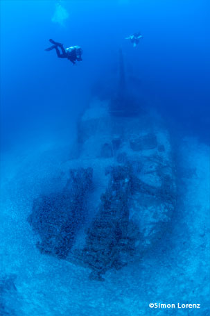 Wreck with scuba divers in Bikini Atoll